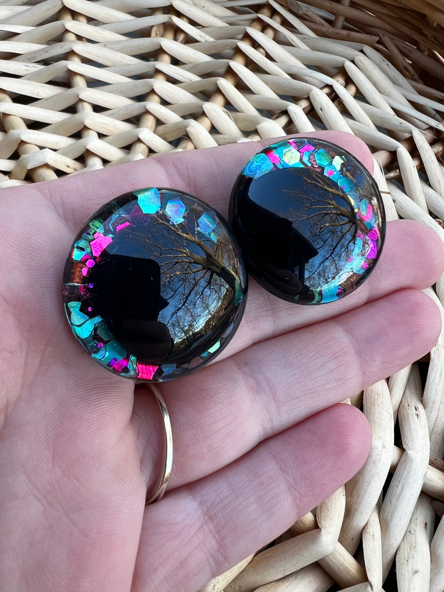 Hand painted safety eyes that feature large kawaii style black pupils with a vibrant shimmery jewel toned iris with purple, pink, and blue glitter throughout. Eyes are for crochet and knit amigurumi 