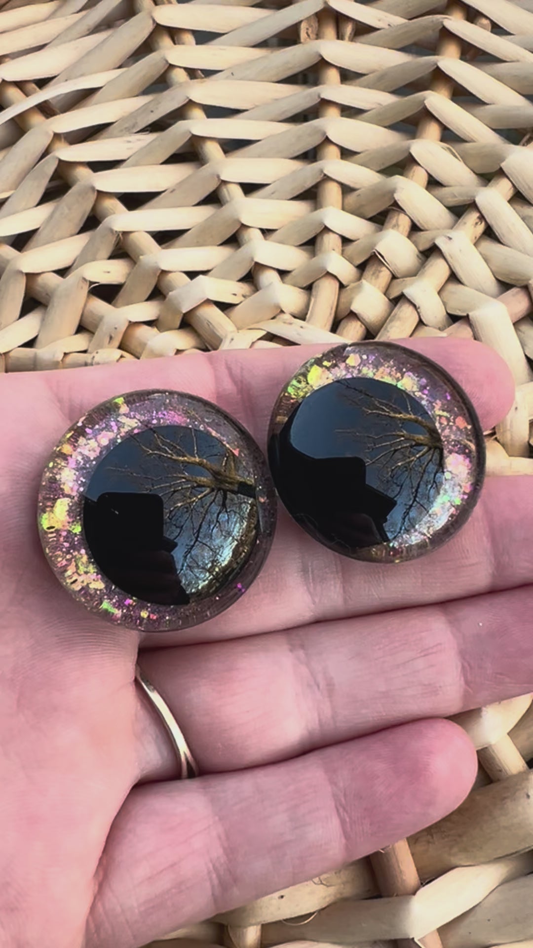 Hand painted safety eyes that feature large kawaii style black pupils and a vibrant orange, pink, and gold sparkly iridescent iris. Eyes are for crochet and knit amigurumi projects.