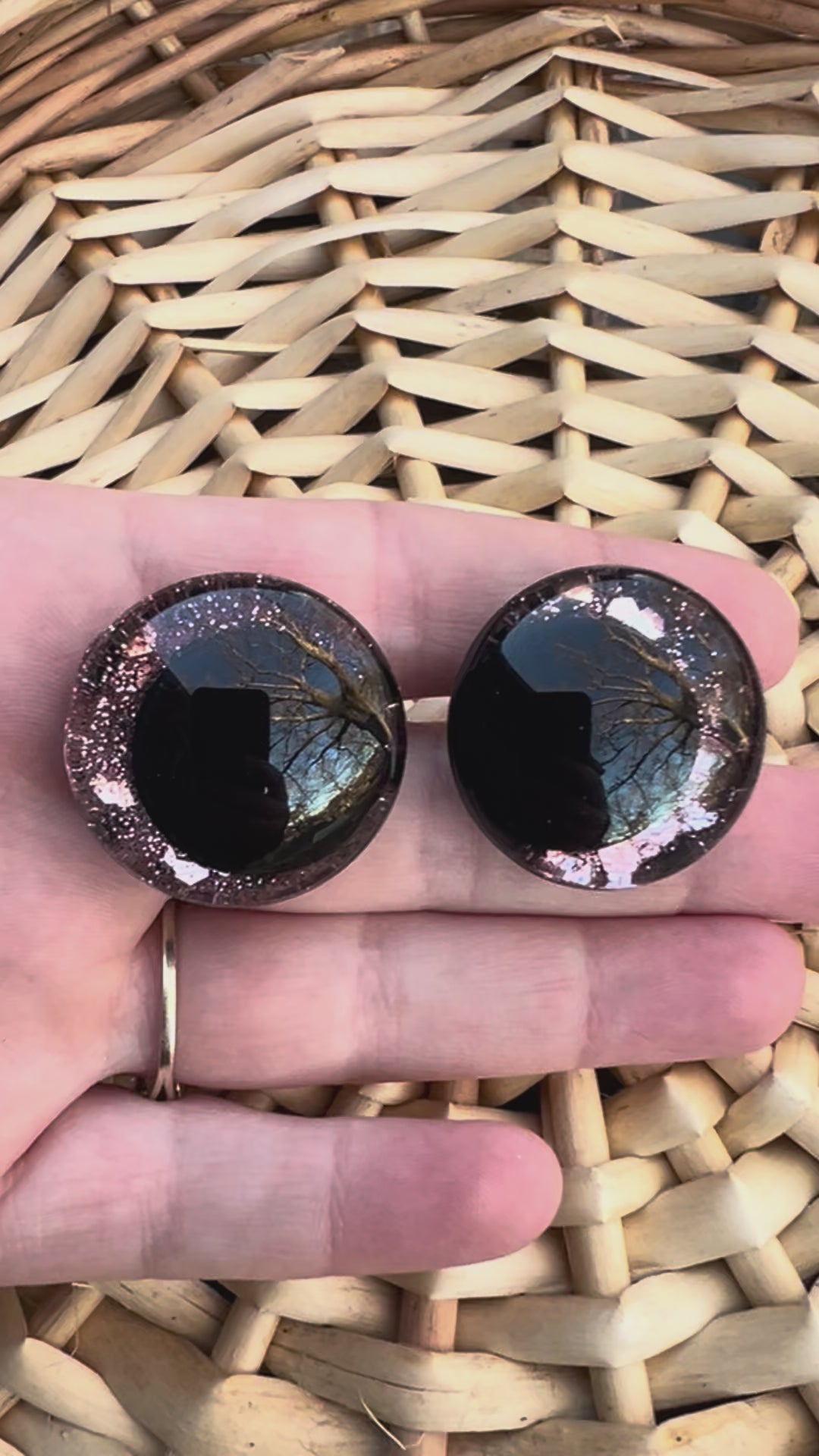 Hand painted safety eyes that feature large kawaii style black pupils with a soft pink iridescent sparkly iris. Eyes are for crochet and knit amigurumi projects.